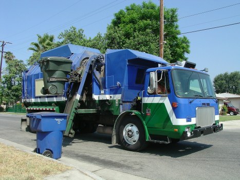 Modern waste removal truck operating in Canary Wharf